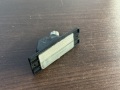 Фонарь подсветки номера Mitsubishi Diamante II 1995-2005